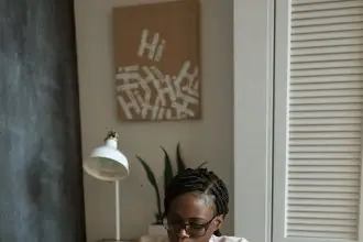 photo of woman working on white paper