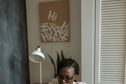 photo of woman working on white paper